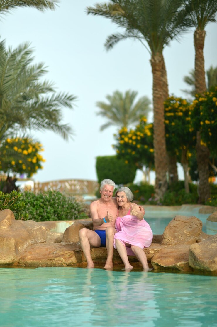 senior-couple-tropic-hotel-resort-near-pool_484921-26992